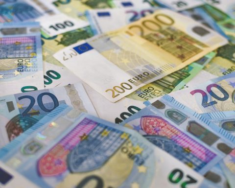 20 euro bill on brown wooden table