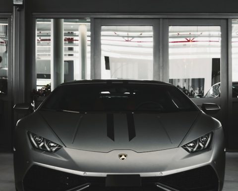 gray coupe on parking area
