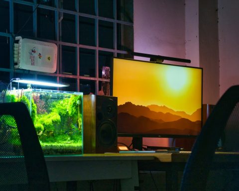 a computer monitor sitting on top of a desk