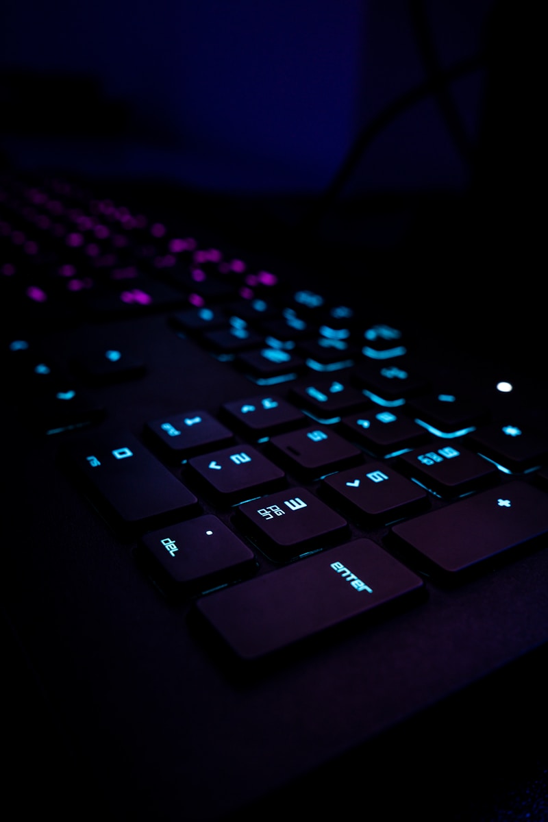 black computer keyboard on blue textile